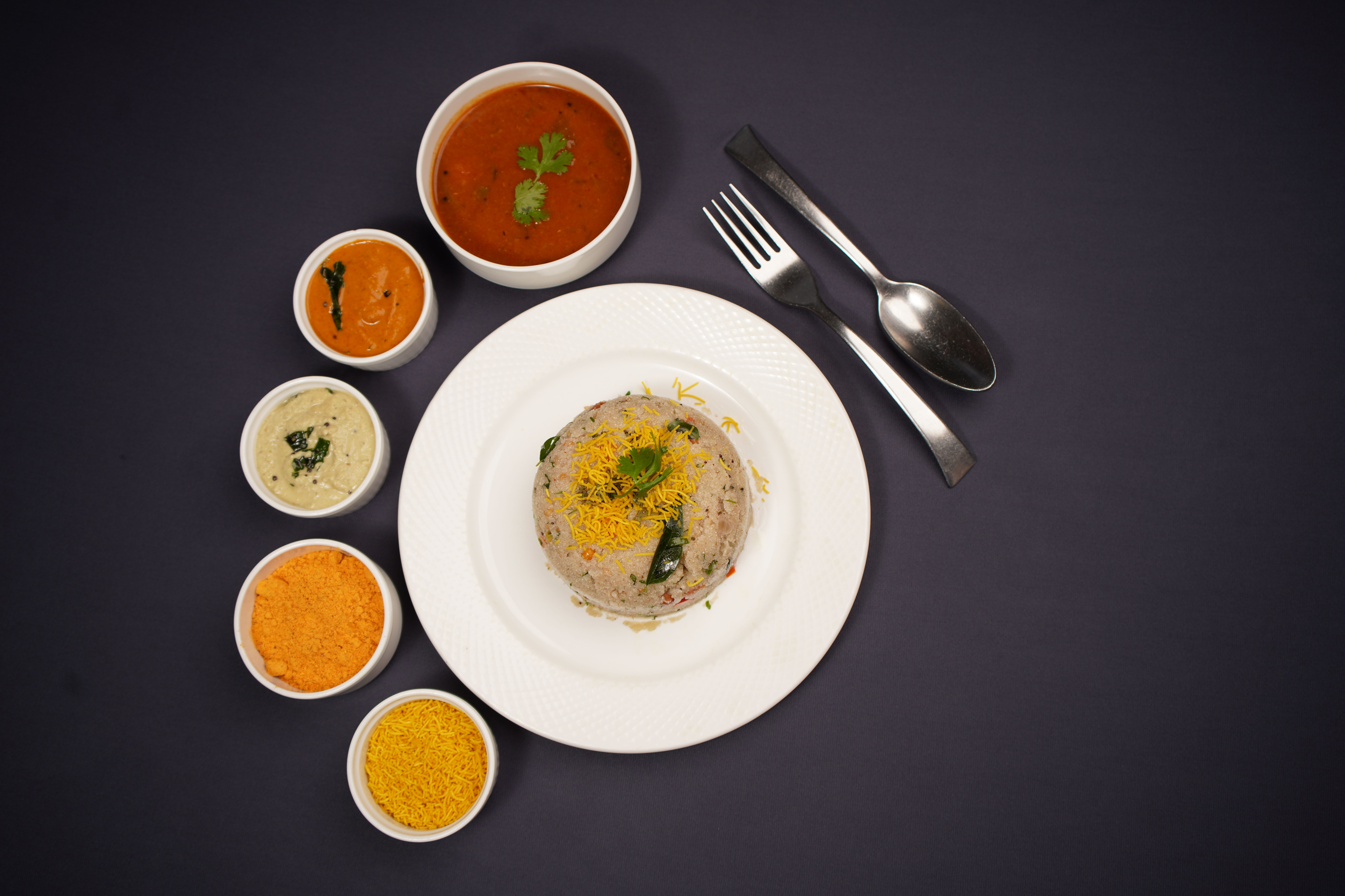Soft idlis served with flavorful sambar and fresh chutney